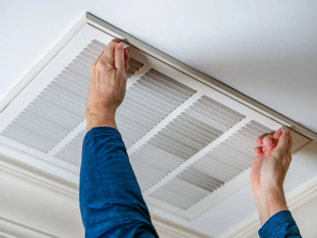 ductwork cleaning by a professional working